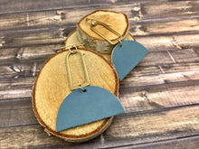 Load image into Gallery viewer, Boho Brass Earrings with light blue leather semi-circle
