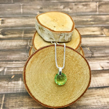 Load image into Gallery viewer, Small green round pendant with silver bail and chain
