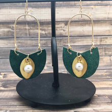 Cargar imagen en el visor de la galería, Brass Leaf and Pearl Charm hanging from metallic leather and all attached to a gold plated hoop earrings
